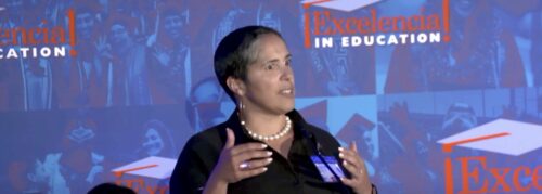 Dr. Shirley Collado at a podium