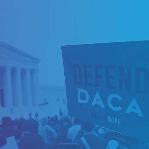Protester holding up Defend DACA sign