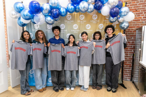 scholars holding davidson shirts